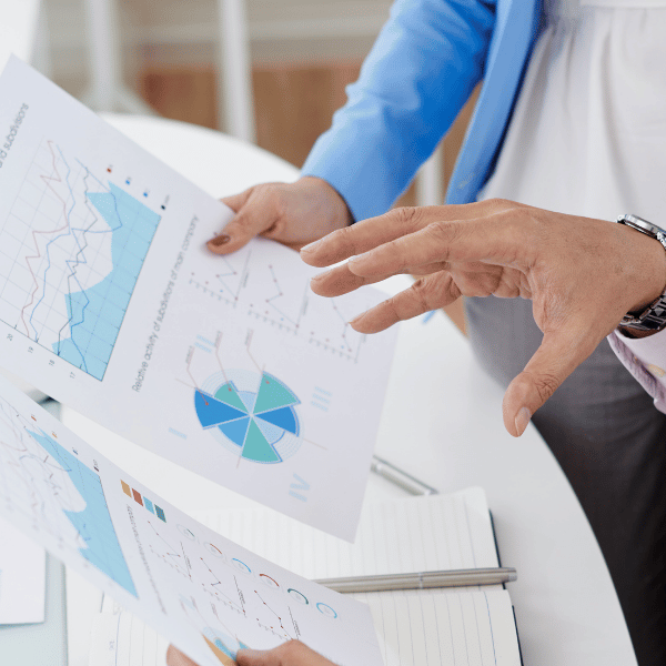 Healthcare professionals reviewing claim denial rate benchmark charts and revenue cycle data reports