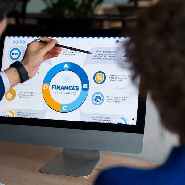 Healthcare professionals reviewing financial data on a computer screen to understand revenue cycle management benefits, including improved financial performance, reduced denials, and stronger cash flow.
